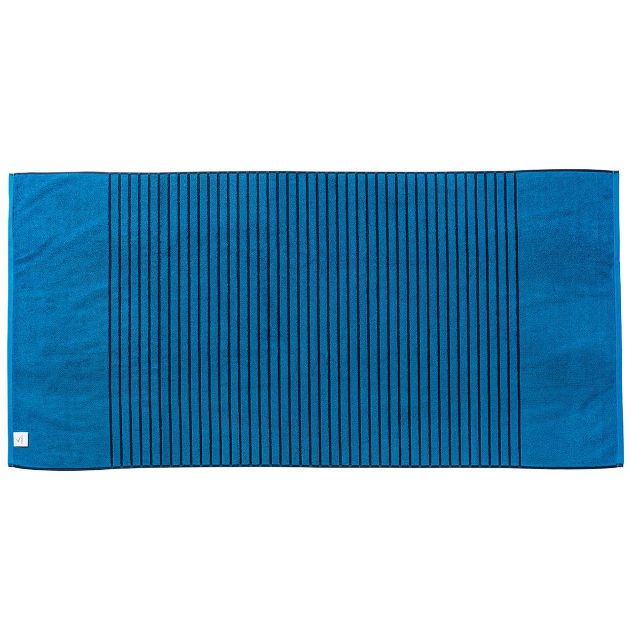 A reversible two-tone towel in deep blue with textured stripes, featuring a small logo on one corner. A reversible two-tone towel in deep blue with textured stripes, featuring a small logo on one corner.