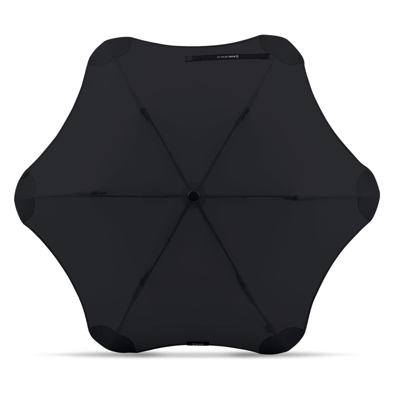 A black BLUNT Metro UV umbrella with a unique sculpted shape and a central button mechanism. It features branding. A black BLUNT Metro UV umbrella with a unique sculpted shape and a central button mechanism. It features branding.
