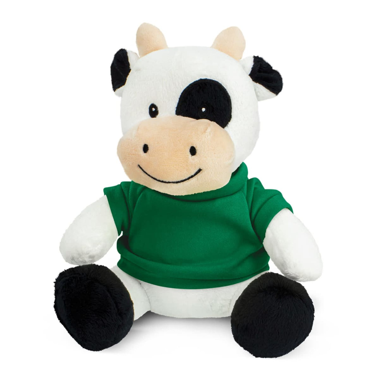 A plush cow toy with a white and black design, wearing a green shirt, seated with a smiling expression.
