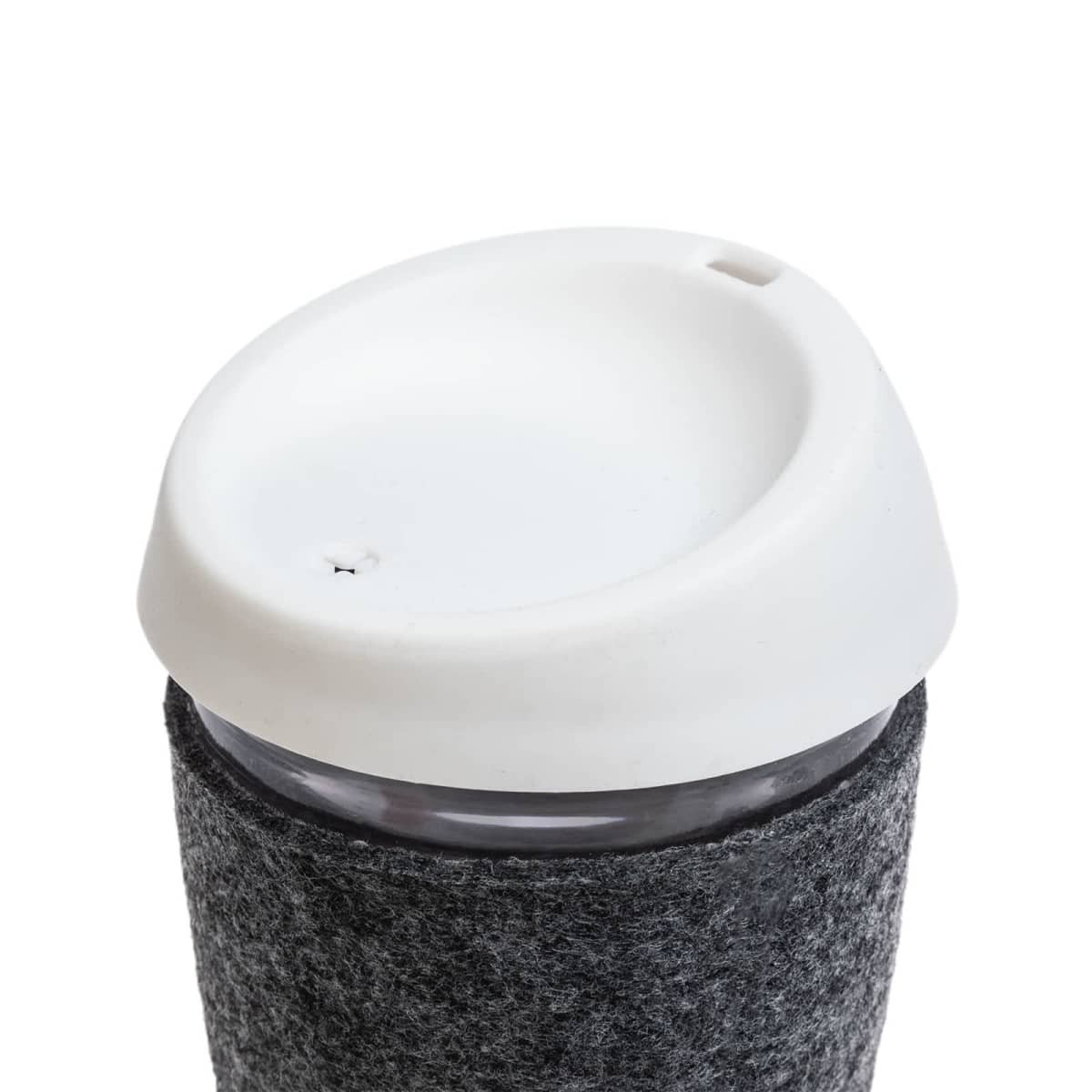 A reusable coffee cup featuring a glass body, a silicone lid, and a textured RPET band for grip.