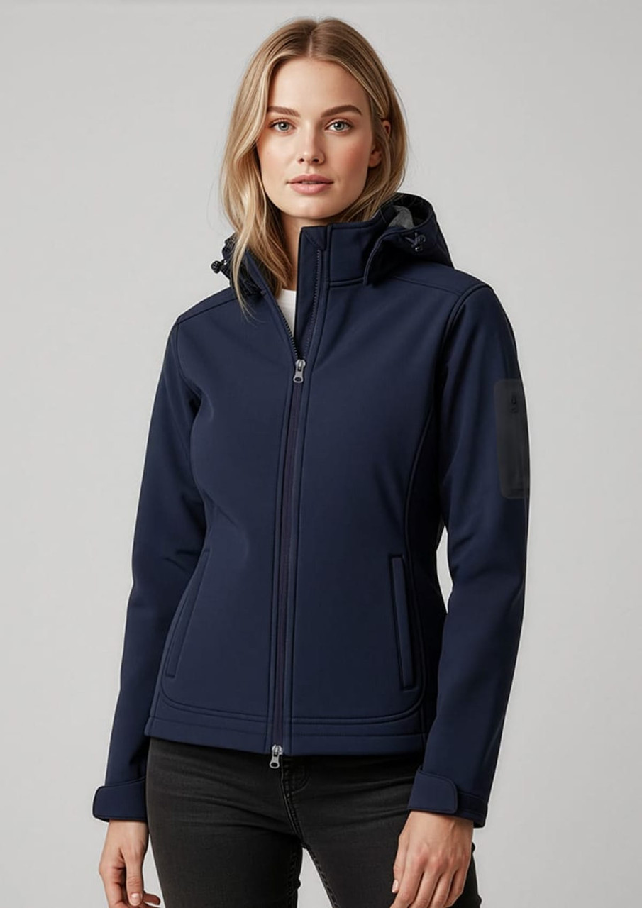 A women's soft shell jacket in navy blue with a hood, featuring a logo on the shoulder.
