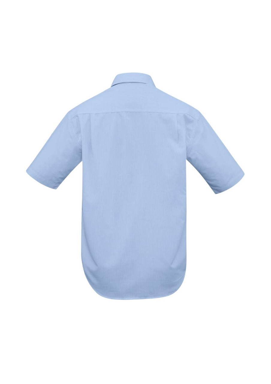 A light blue short sleeve button-up shirt with a back yoke and curved hem. Features a logo on the back.