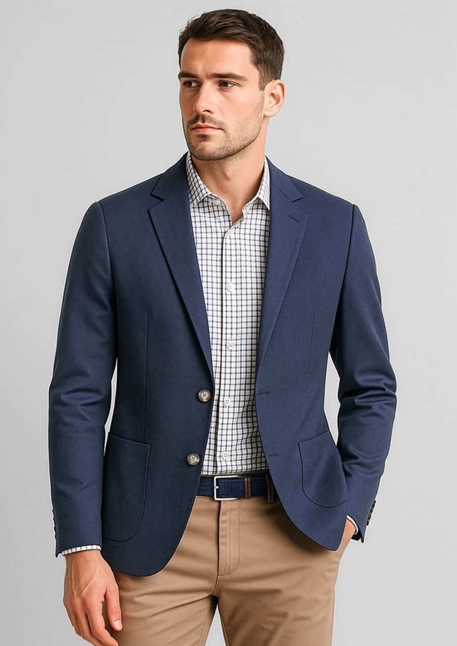 A navy blue men's blazer with a slim fit, featuring two buttons and side pockets, worn over a checked shirt.