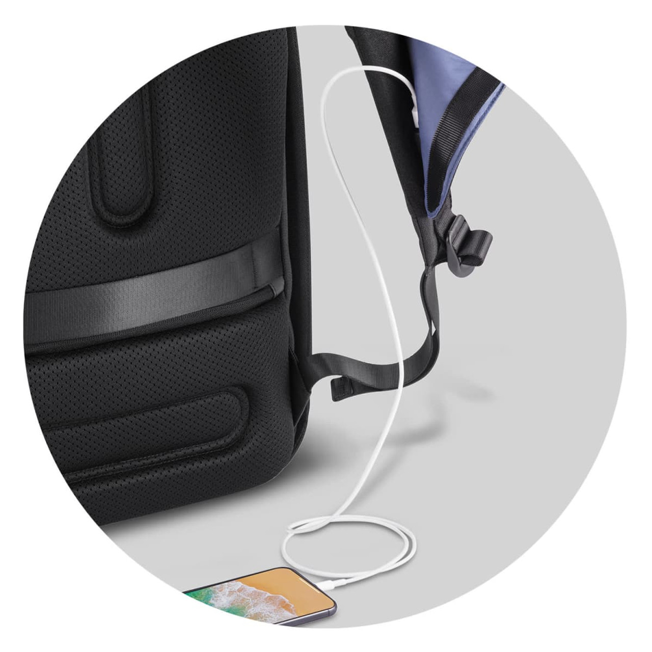 A black gym bag with a charging cable and a smartphone connected, featuring a textured surface and adjustable strap.