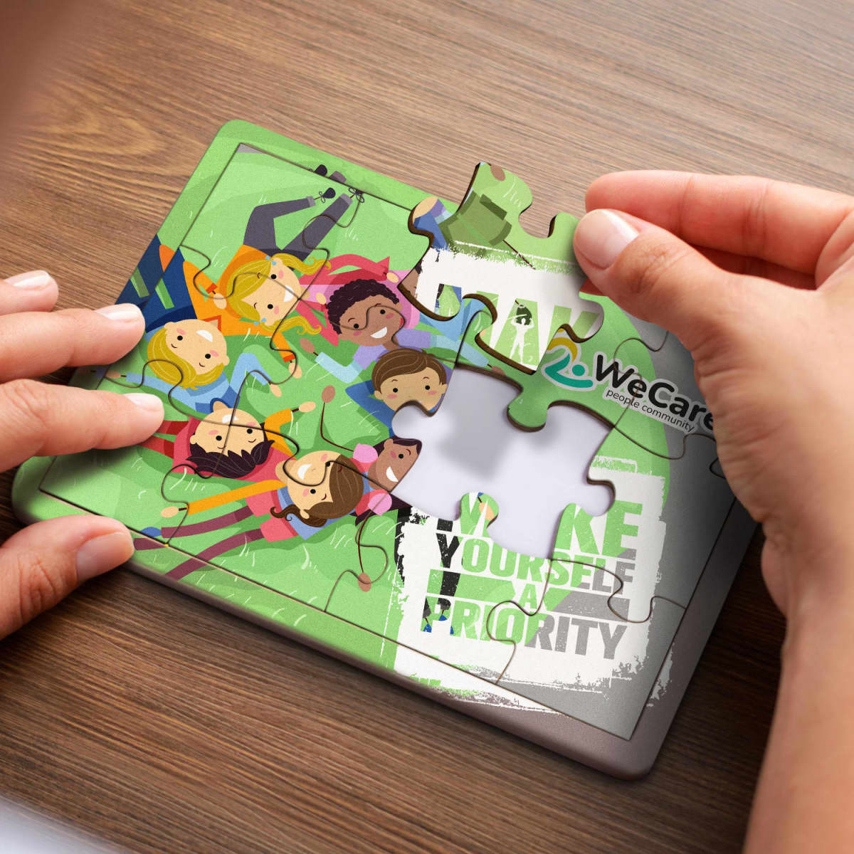 A colourful 12-piece wooden jigsaw puzzle featuring diverse cartoon characters being assembled by hands.