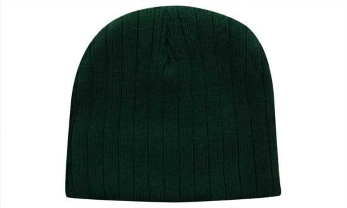 A green cable knit beanie toque with a ribbed texture, featuring a logo on the side.