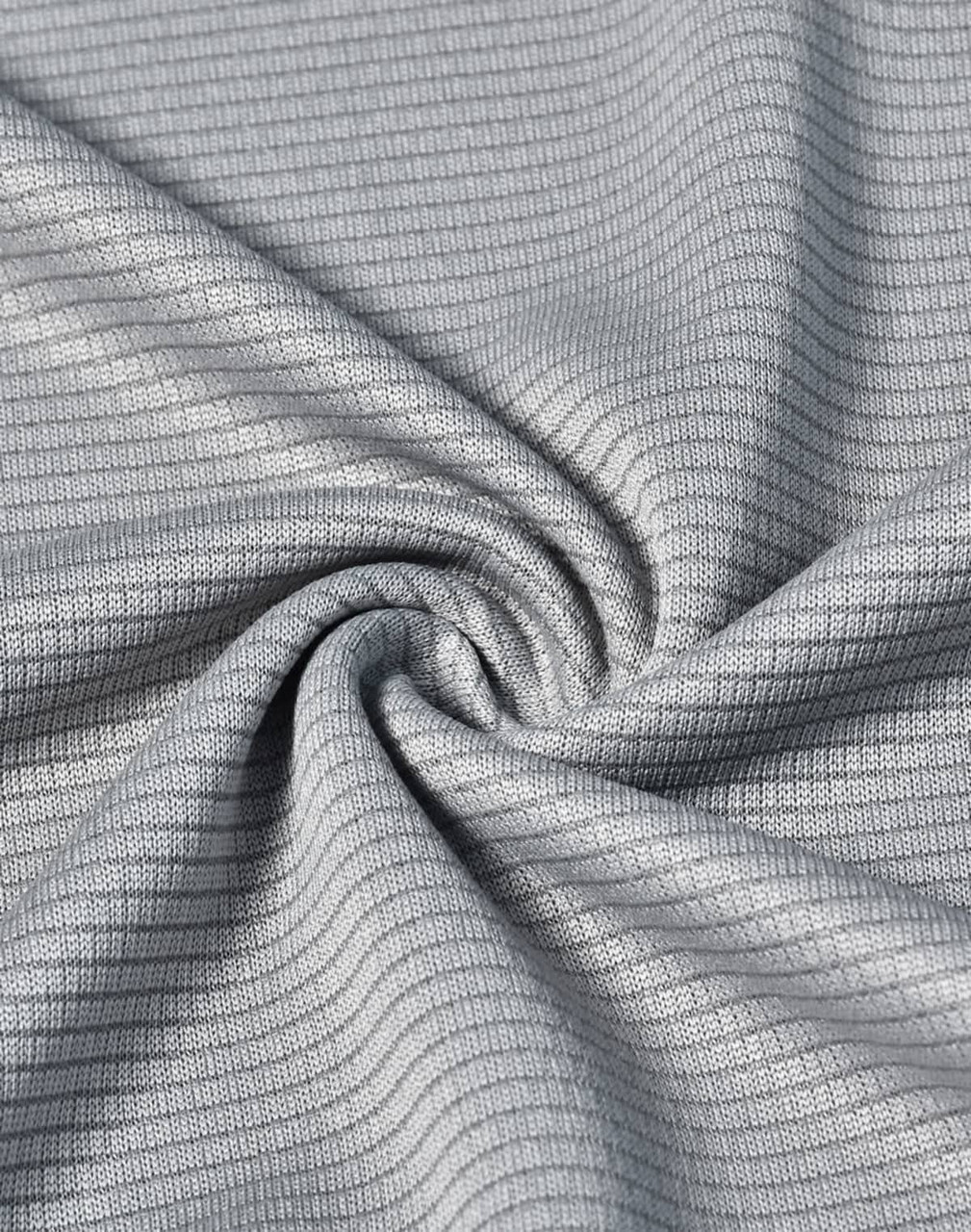 A lightweight grey fabric with a textured pattern, ideal for performance clothing.