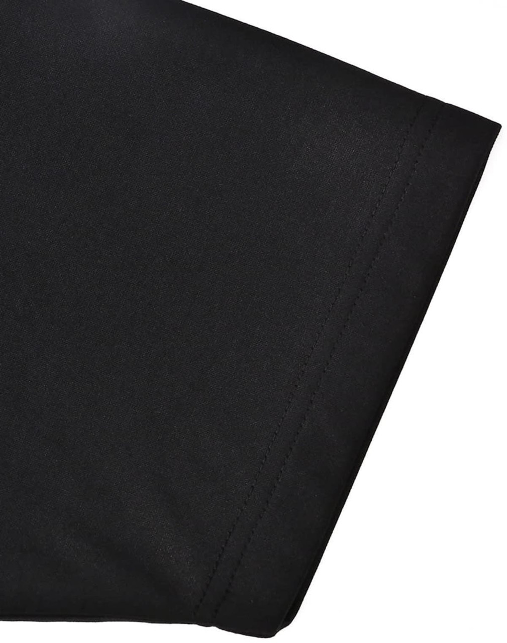 A close-up of a black men's sustainable poly/cotton polo shirt sleeve, featuring a neat seam and soft texture.