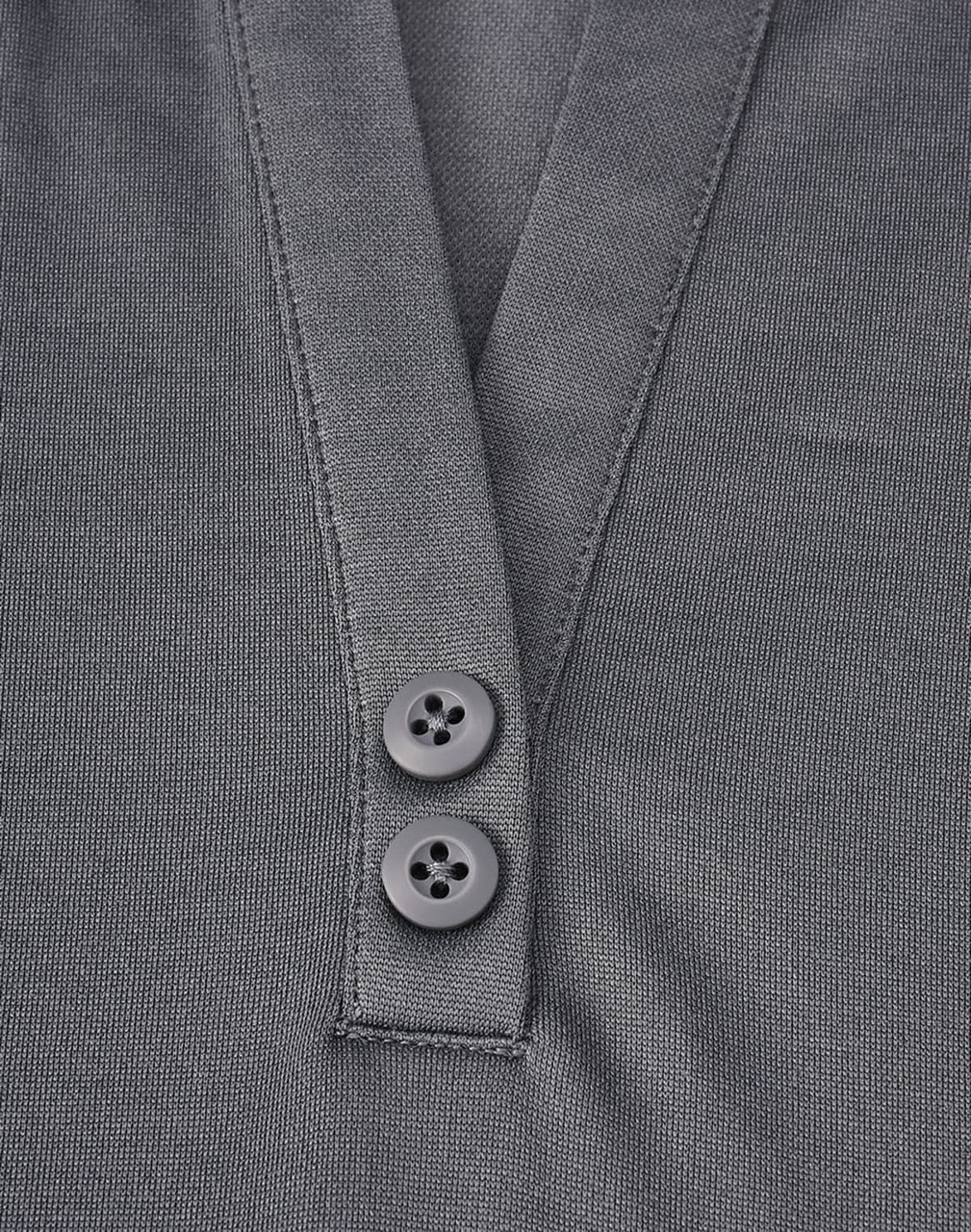 A grey polo shirt featuring a two-button placket and a logo. The fabric is a sustainable poly/cotton blend.