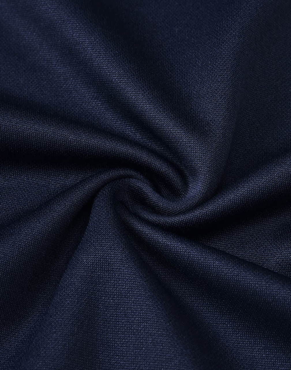 A close-up of dark navy fabric, showcasing a smooth polyester and cotton blend with a subtle texture.