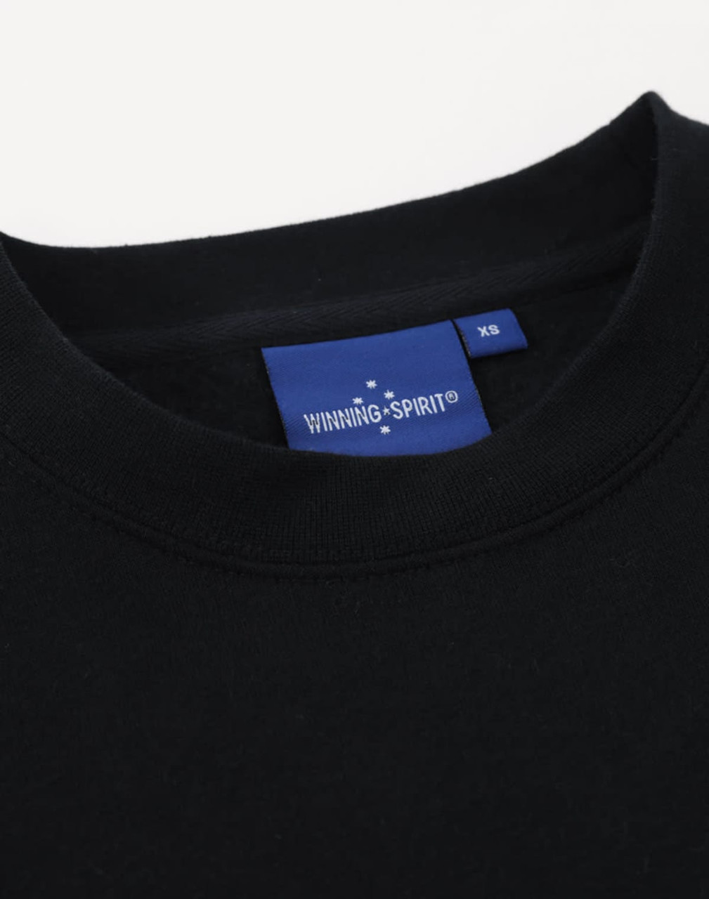 A black crew fleece sweatshirt featuring a round neck and a branding label.