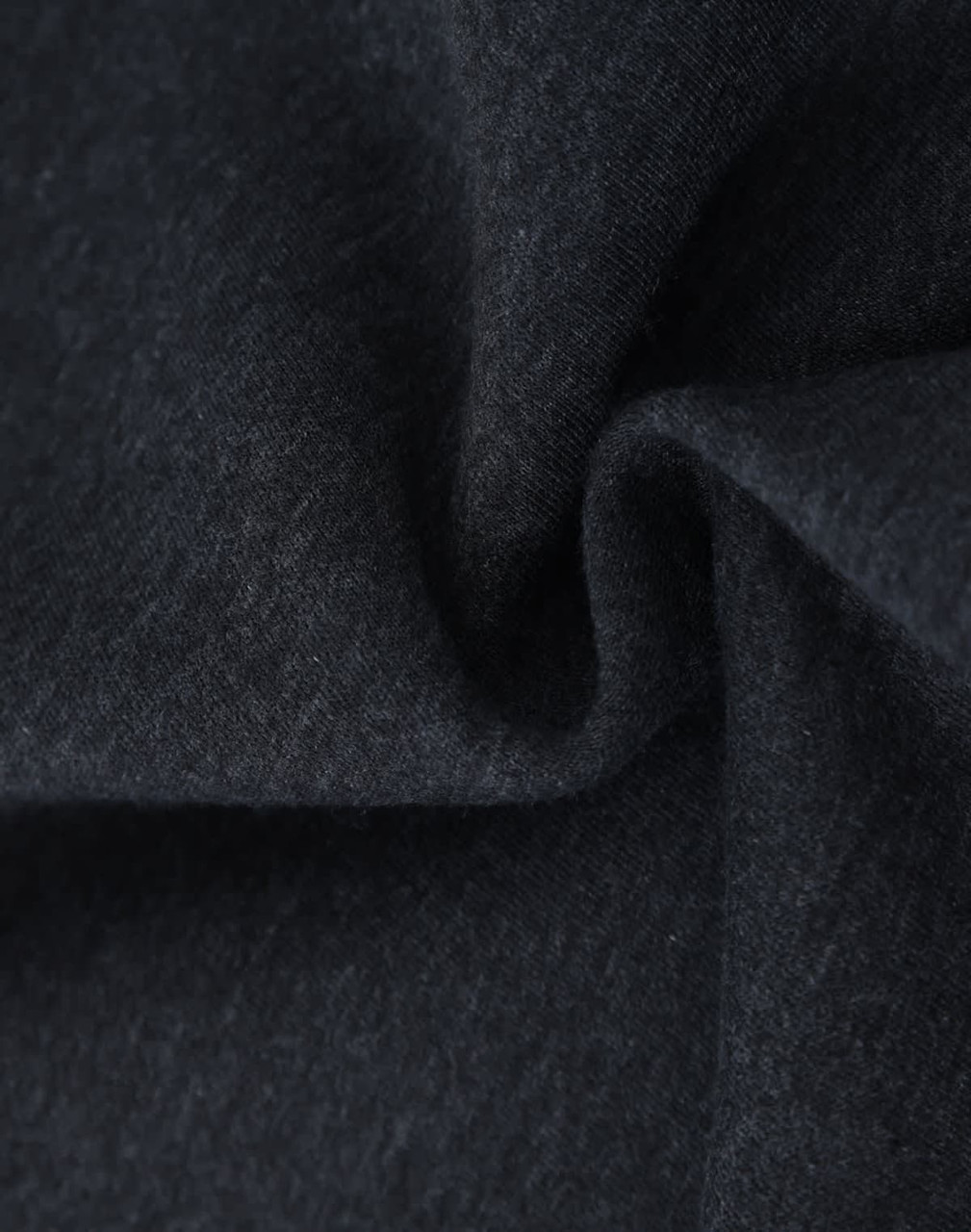 A close-up of dark grey fabric, showcasing a soft and textured fleece material suitable for jumpers.