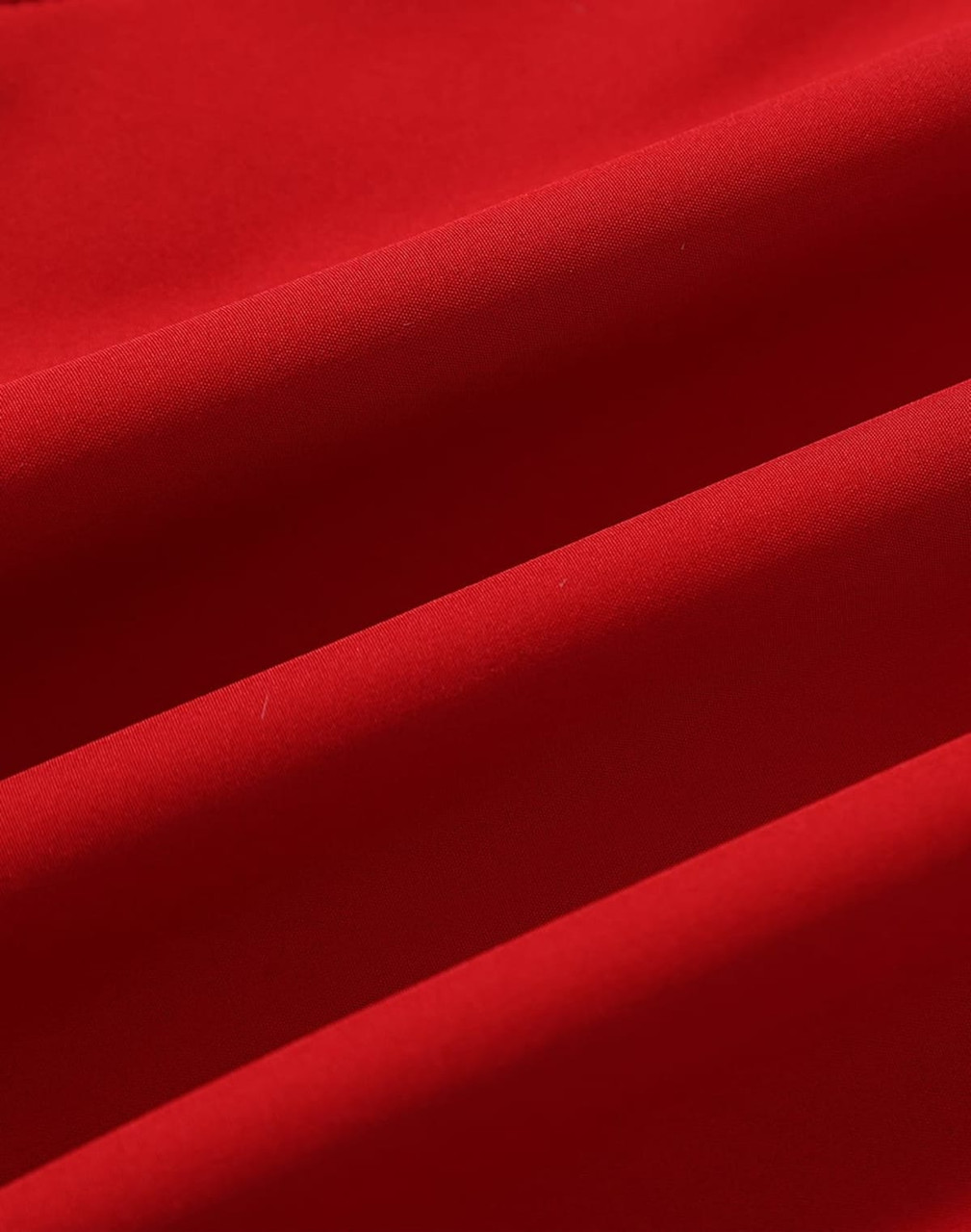 A red softshell fabric showcasing smooth texture and subtle folds, suitable for jackets. Features a logo.