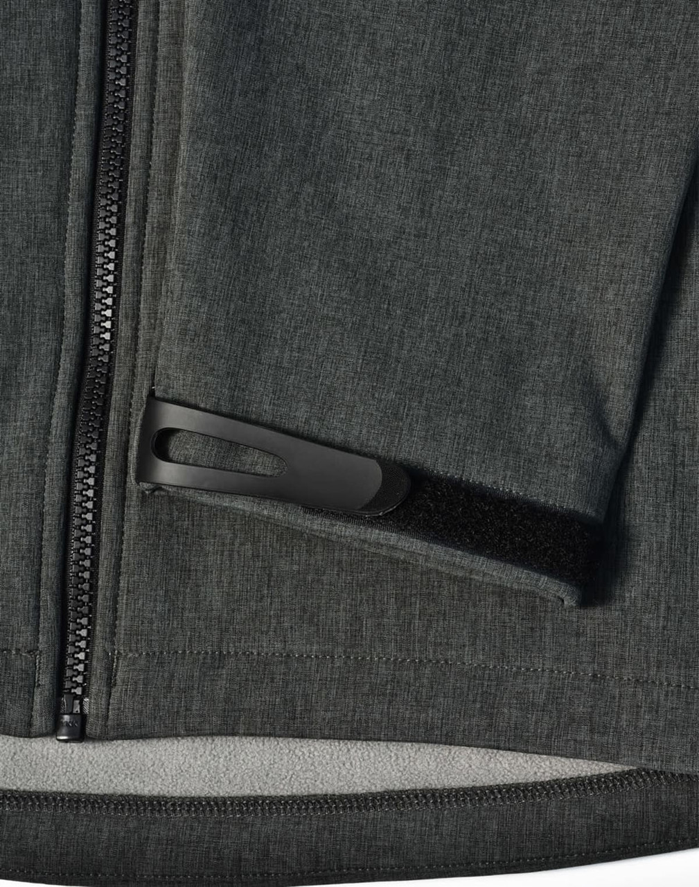 A grey ladies' softshell full zip hoodie featuring a zippered pocket and a logo.