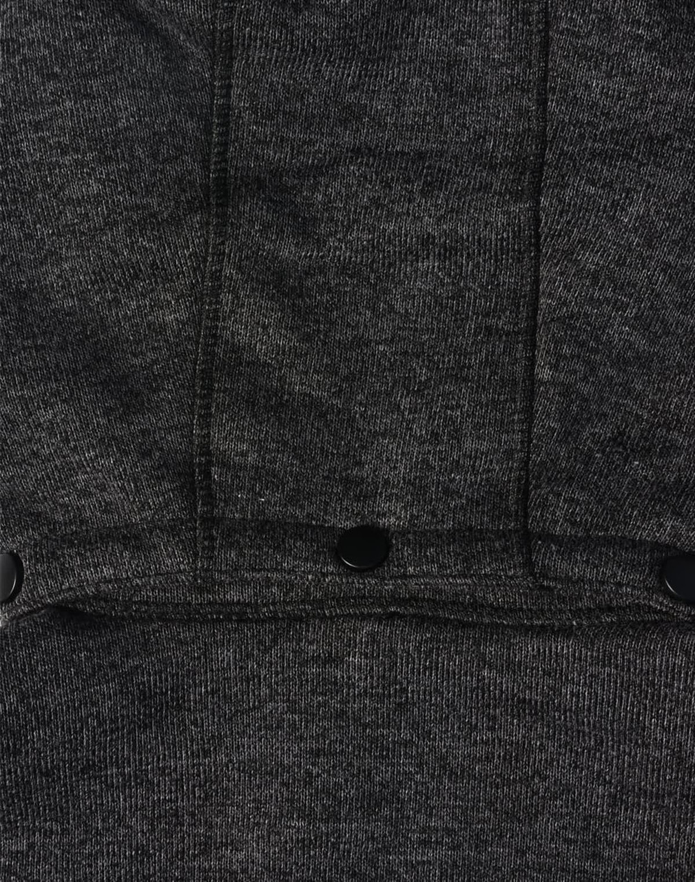 A dark grey fleece jacket featuring a textured fabric and black snap buttons. It has a logo on the garment.