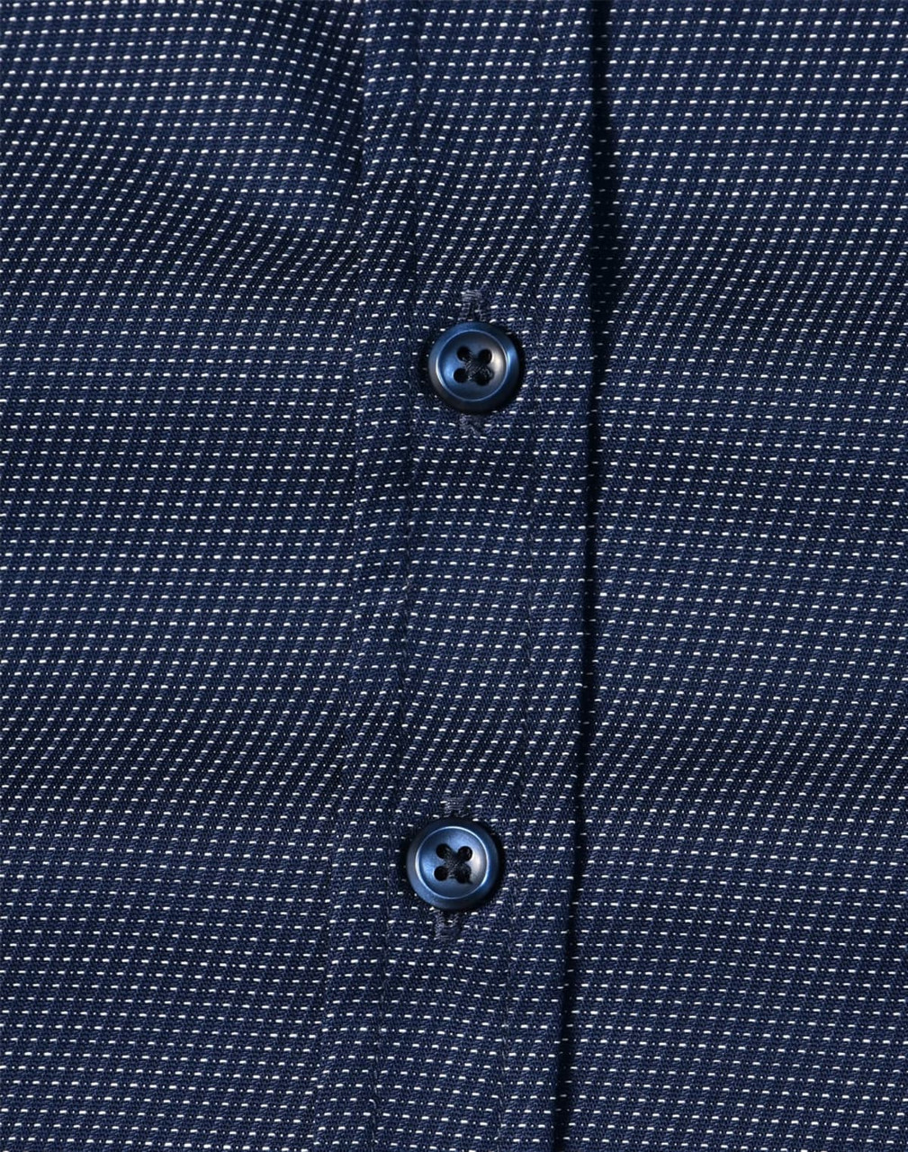 A navy blue button-up shirt with a pin dot pattern and blue buttons. Features a textured fabric design.