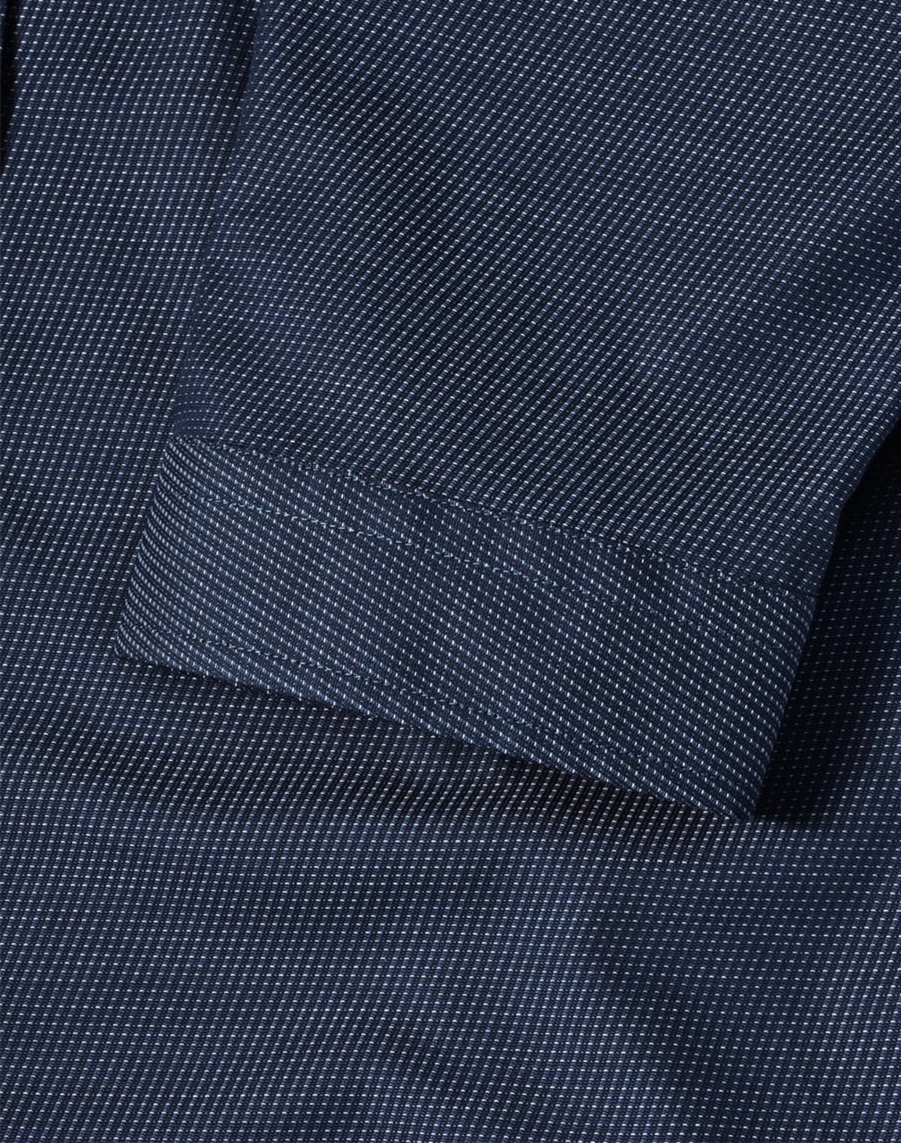 A navy blue button-up shirt featuring a pin dot pattern and 3/4 sleeves, with a folded cuff detail.