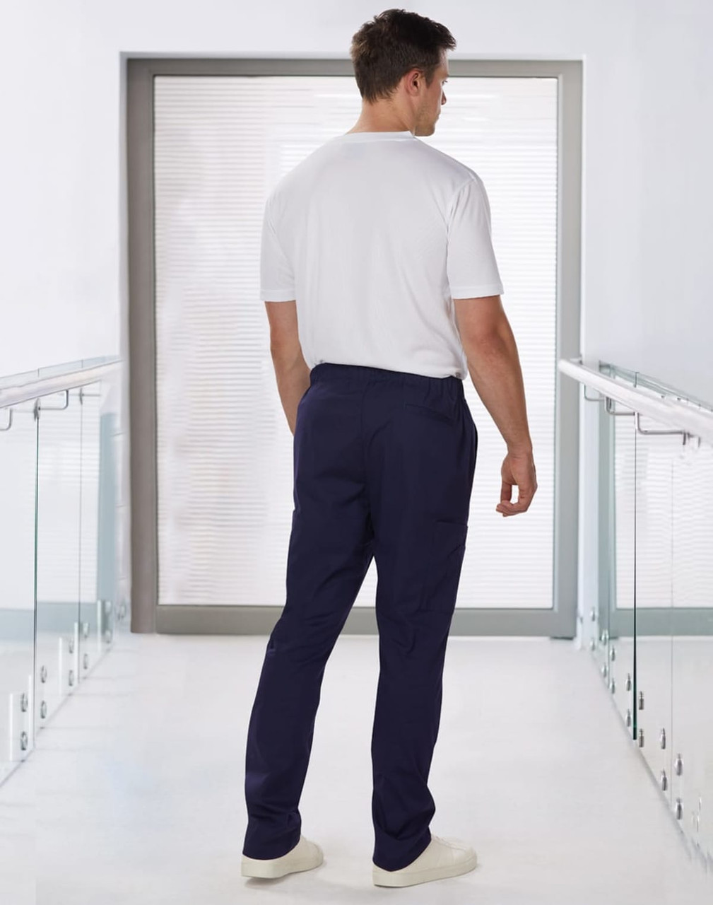 Men's solid colour scrub pants in navy blue, featuring an elastic waistband and a plain back view.