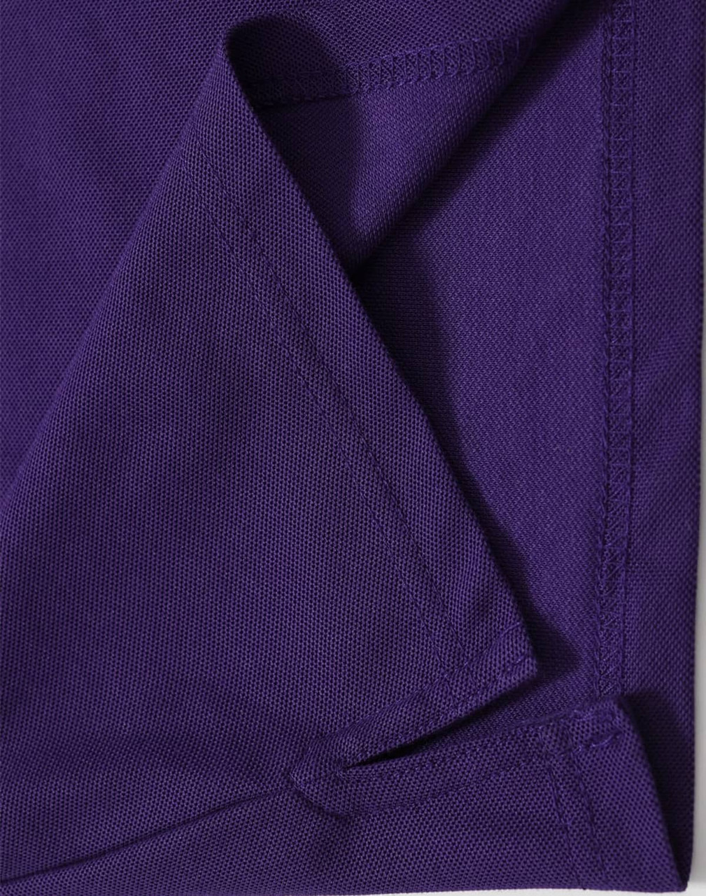 A purple polo shirt featuring a textured fabric and neat stitching, with a logo on the label.