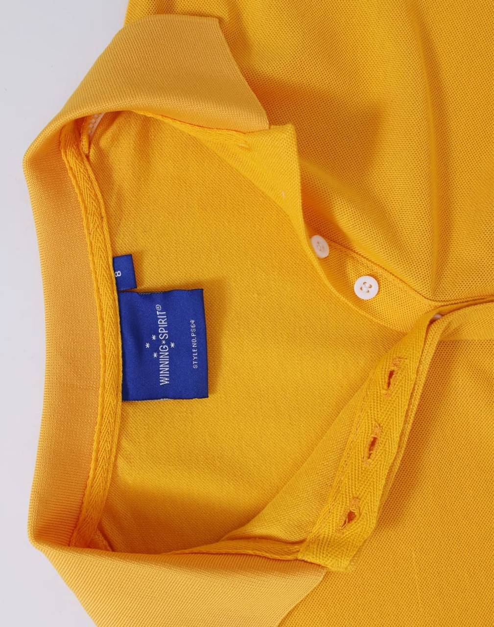 A yellow polo shirt featuring a collar, buttons, and a branded tag inside the neck.