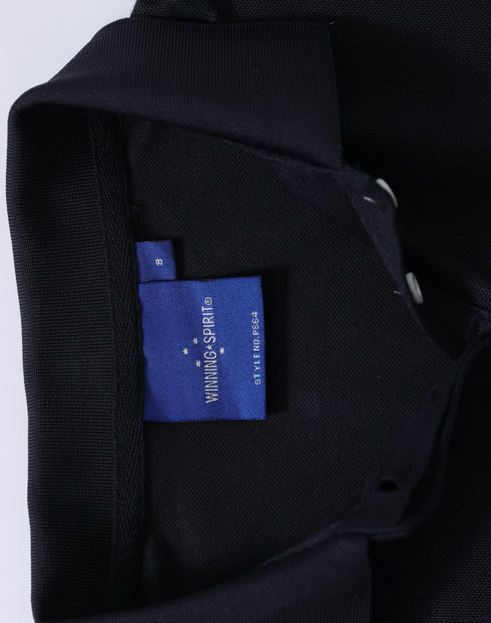 A black polo shirt featuring a collar and a label inside with branding.