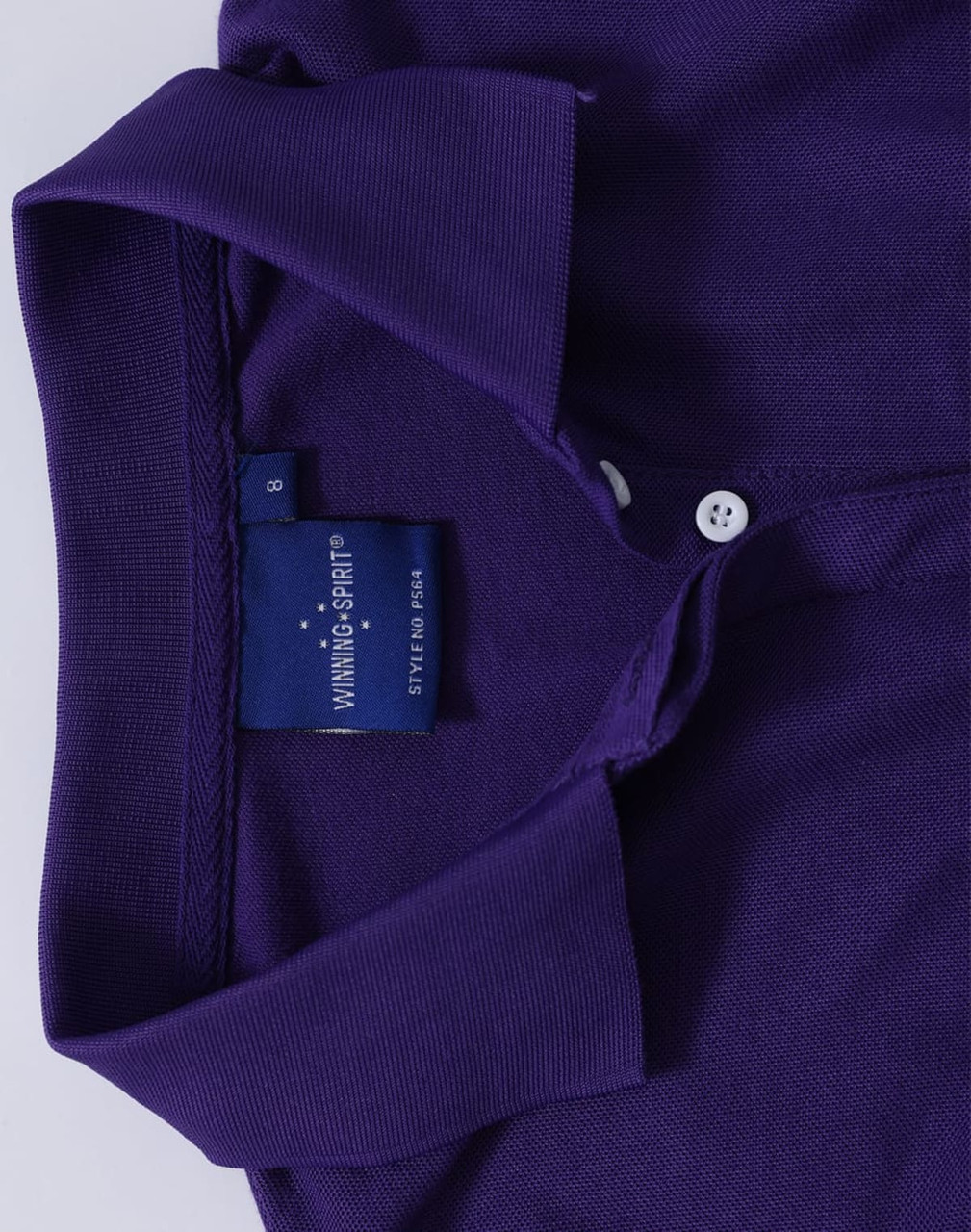 A purple ladies' polo shirt featuring a classic collar and a logo tag near the neckline.