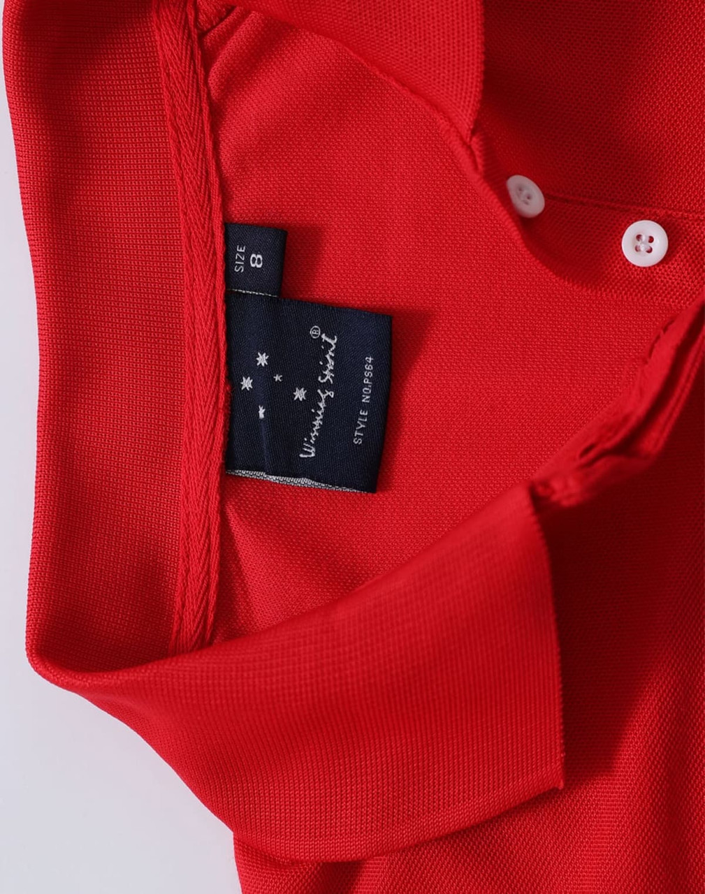 A red polo shirt featuring a collar and buttons, with a brand label on the inner neck area.