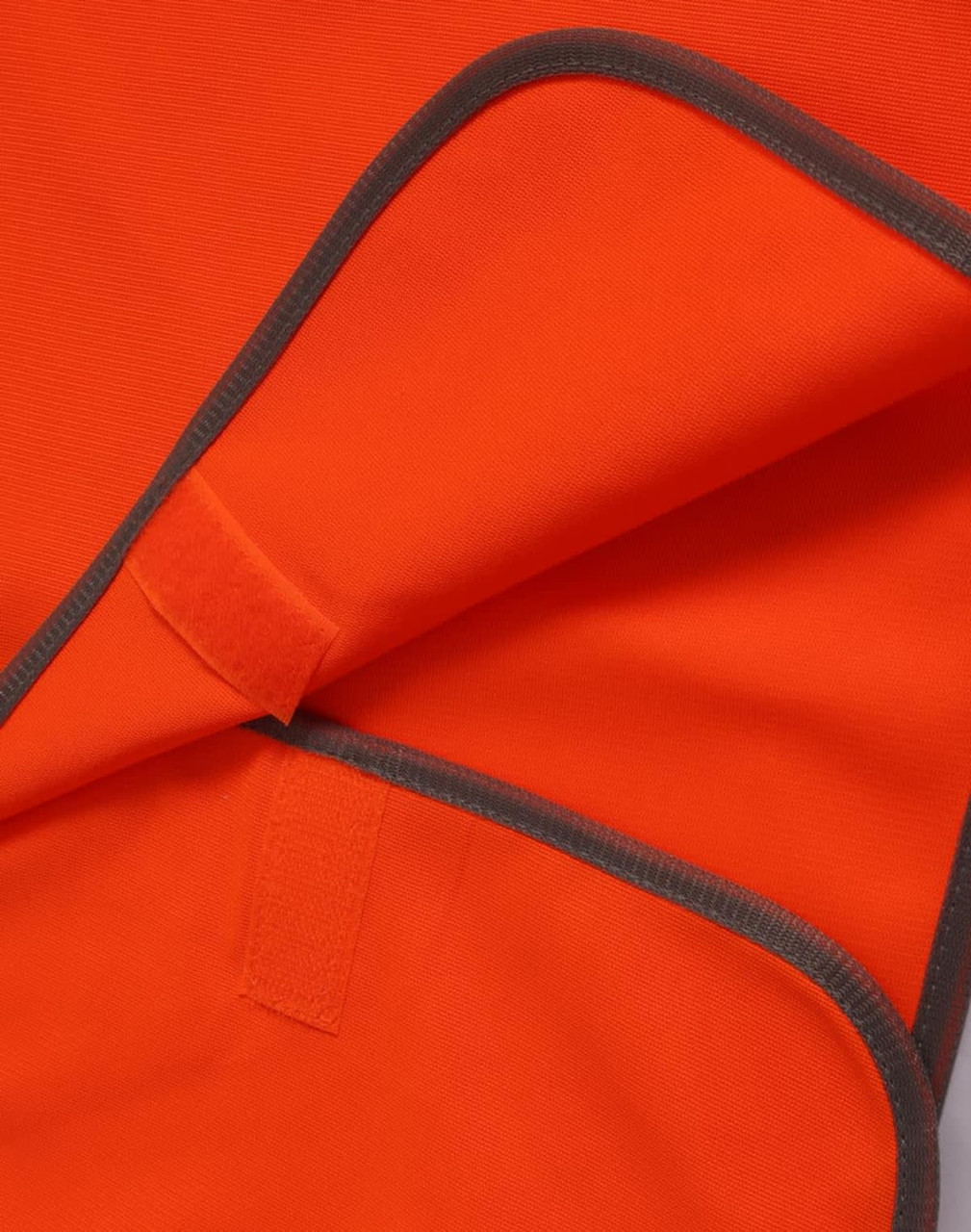 An orange Hi-Vis kid's safety vest with grey trim, featuring a Velcro closure.