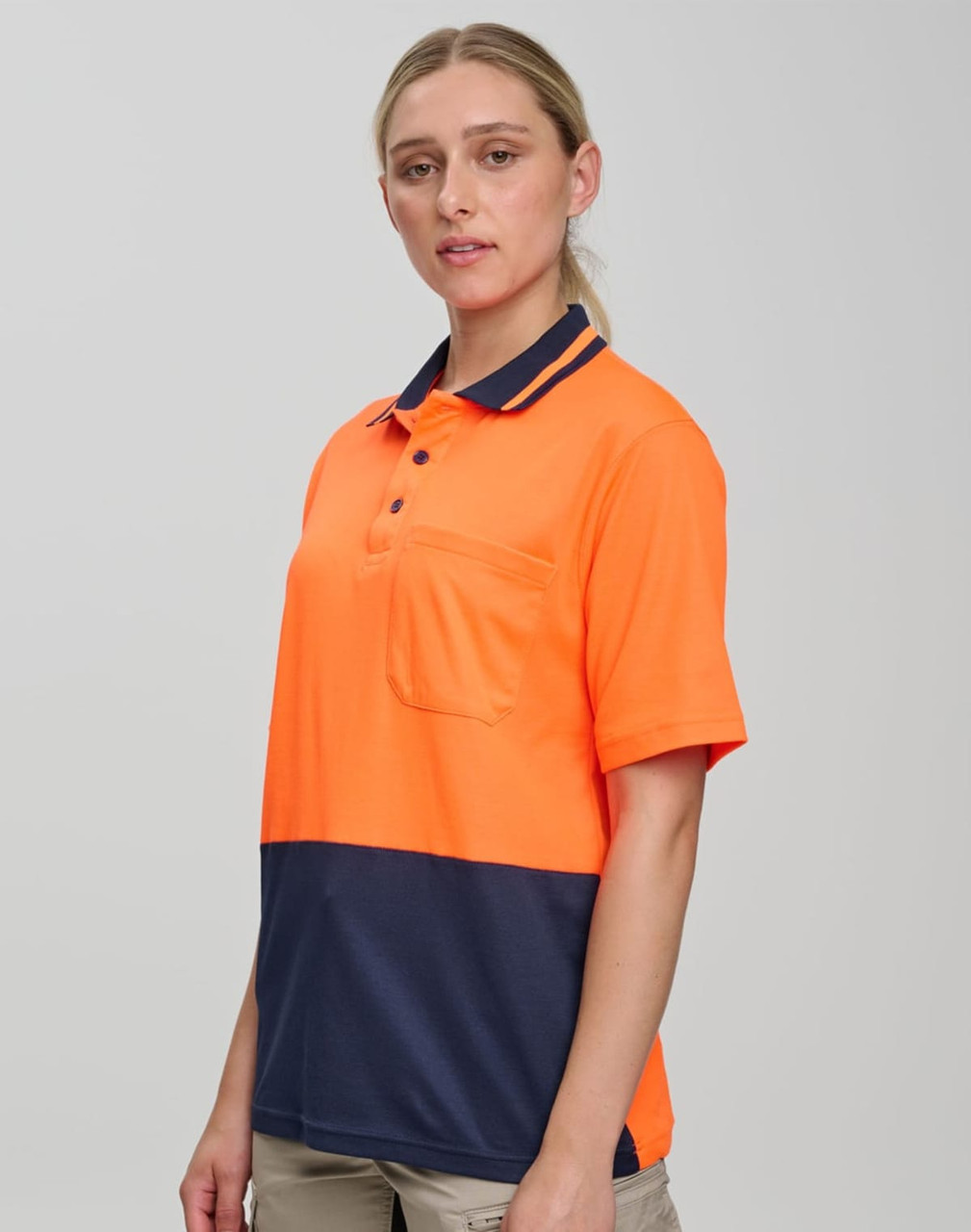 A bright orange and navy safety polo shirt with a chest pocket and a logo.
