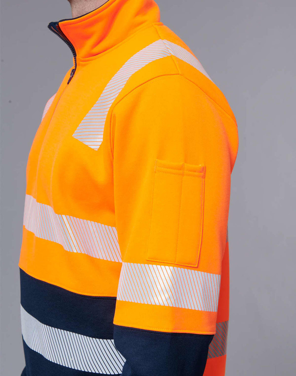 Hi-vis orange work jumper featuring reflective stripes and a navy blue bottom section. Includes a logo on the sleeve.