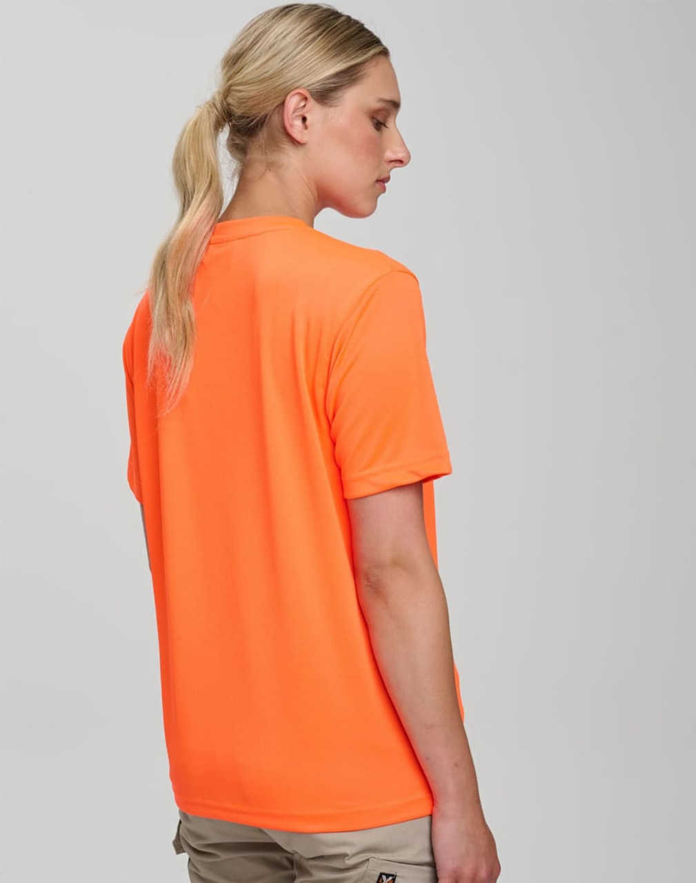A woman wearing a bright orange safety tee, viewed from the back, featuring a logo on the garment.