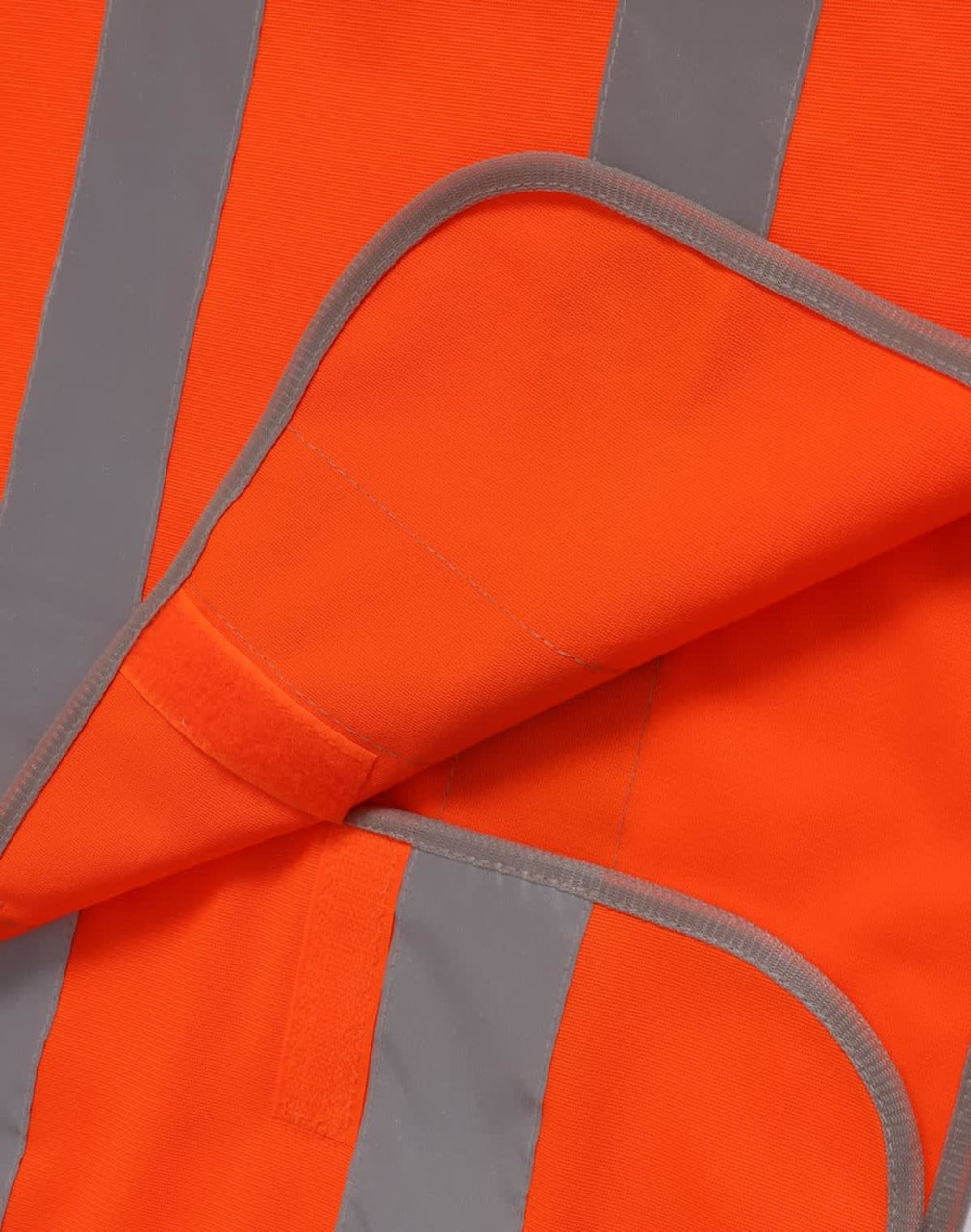 An orange safety vest featuring grey shoulder reflective tapes and a pocket detail.