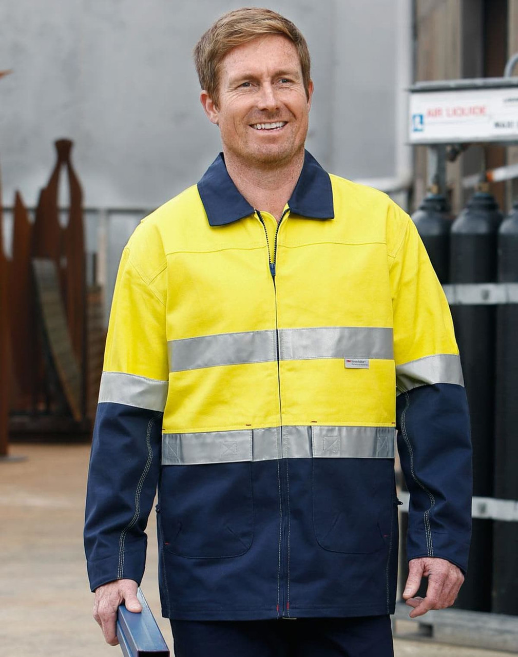 A Hi-Vis two-tone work jacket in yellow and navy with reflective 3M tapes, featuring a logo on the chest.