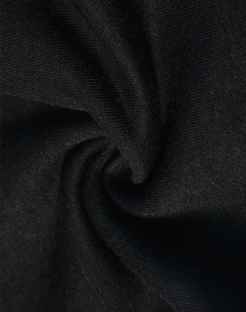 A close-up of black poly/cotton fabric, featuring a soft and smooth texture suitable for sweat pants.
