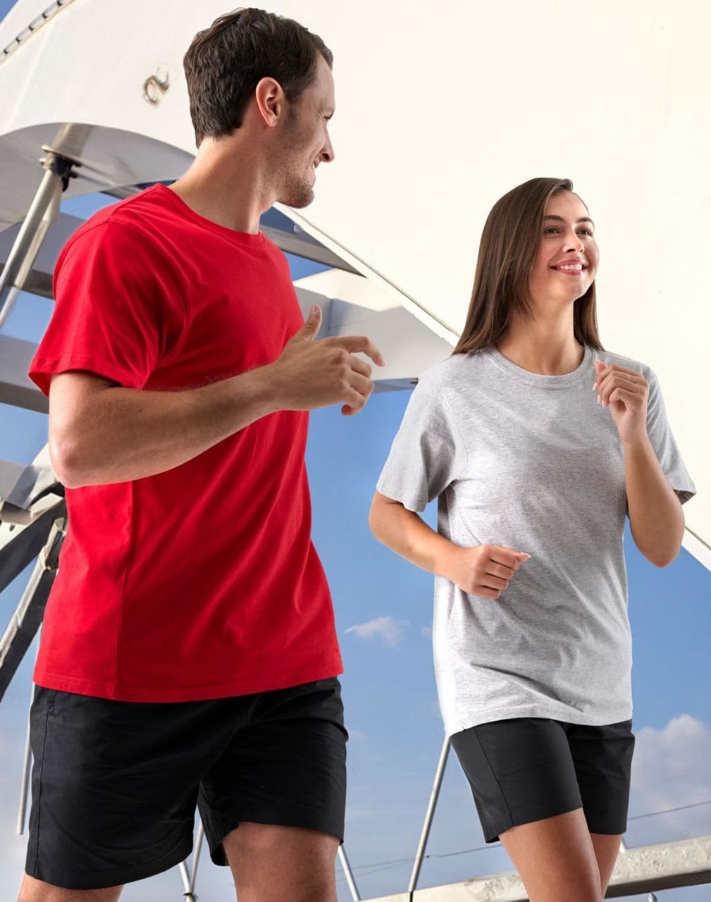 A unisex cotton tee in black and grey, displayed by a man and woman, featuring a logo on the garments.