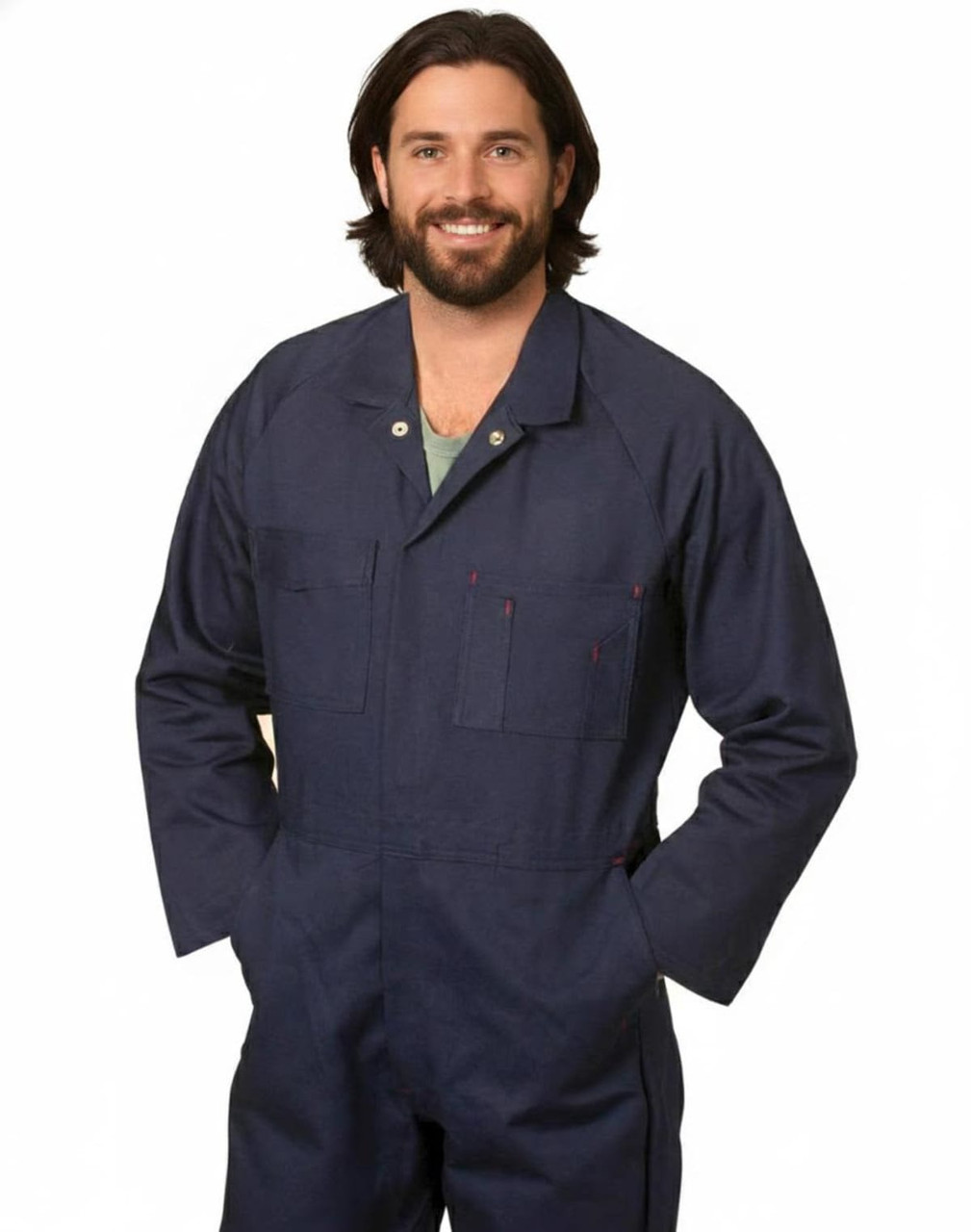 A man wearing a navy blue cotton drill coverall with multiple pockets and a logo.