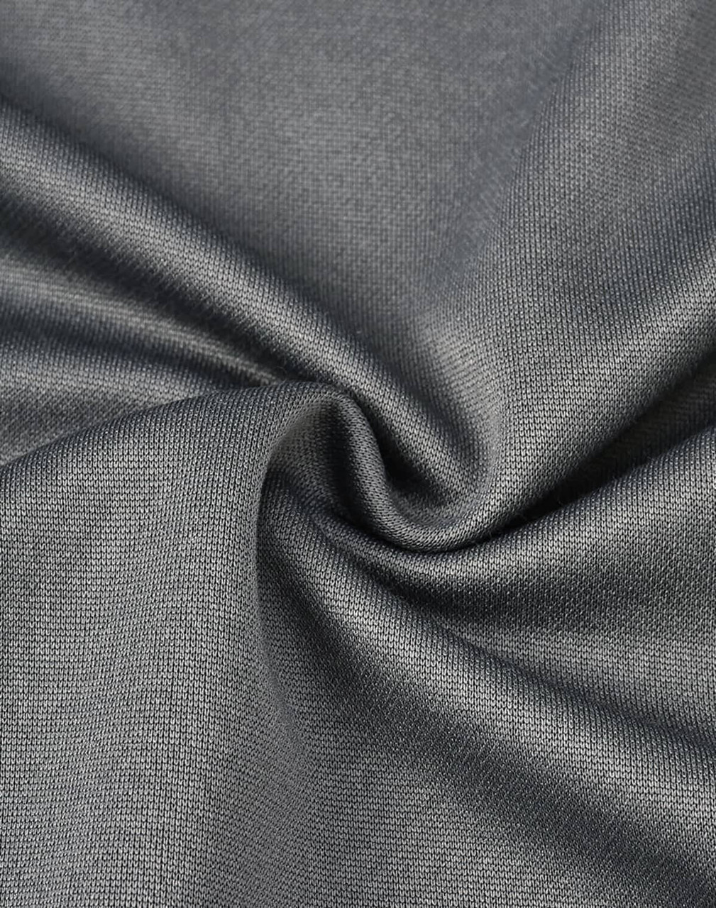A close-up of grey sustainable poly/cotton fabric, showing its smooth texture and weave pattern.
