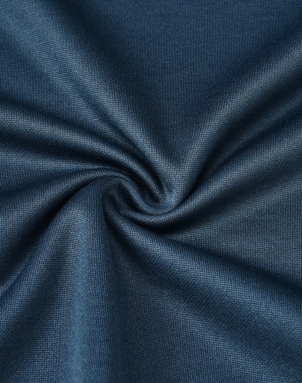 A dark teal fabric swatch, showcasing a soft, sustainable poly/cotton blend with a smooth texture.