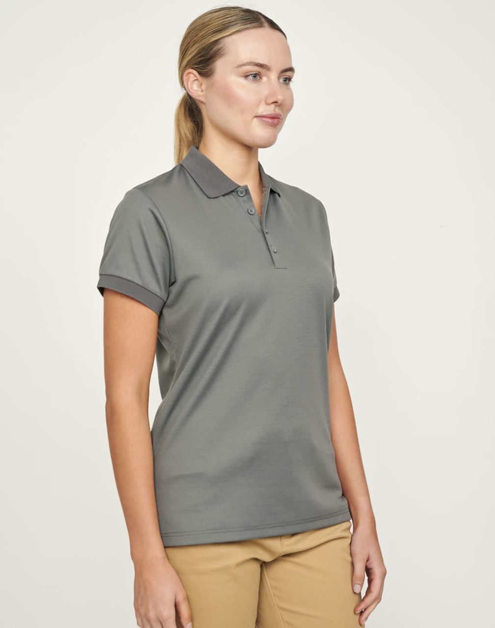 A grey women's polo shirt made from sustainable poly/cotton fabric, featuring a collar and short sleeves.