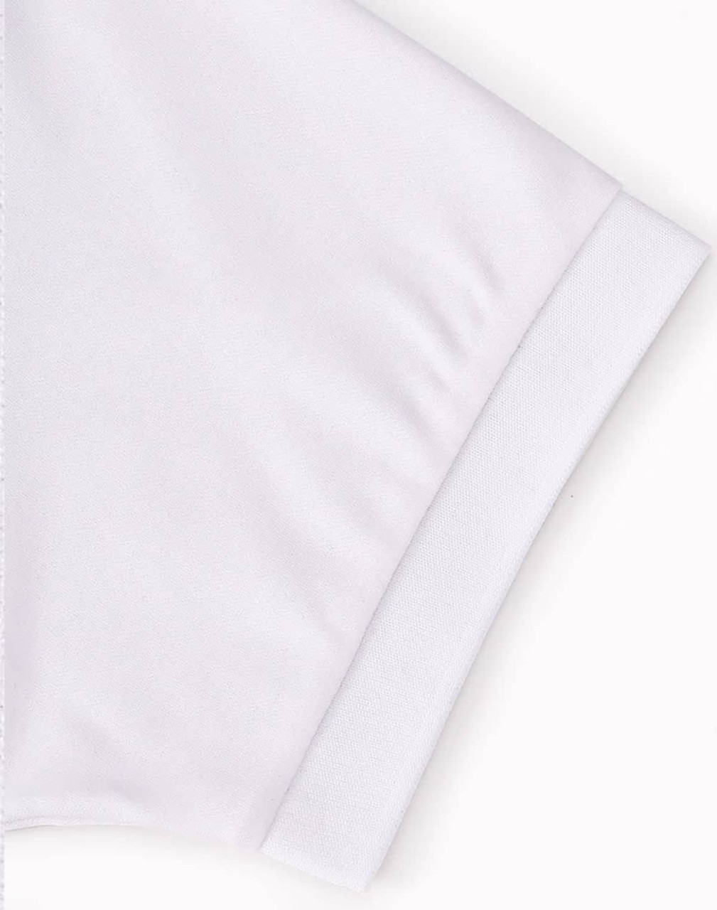 A white polo shirt featuring a fold-over collar and cuff, with a logo on the sleeve.