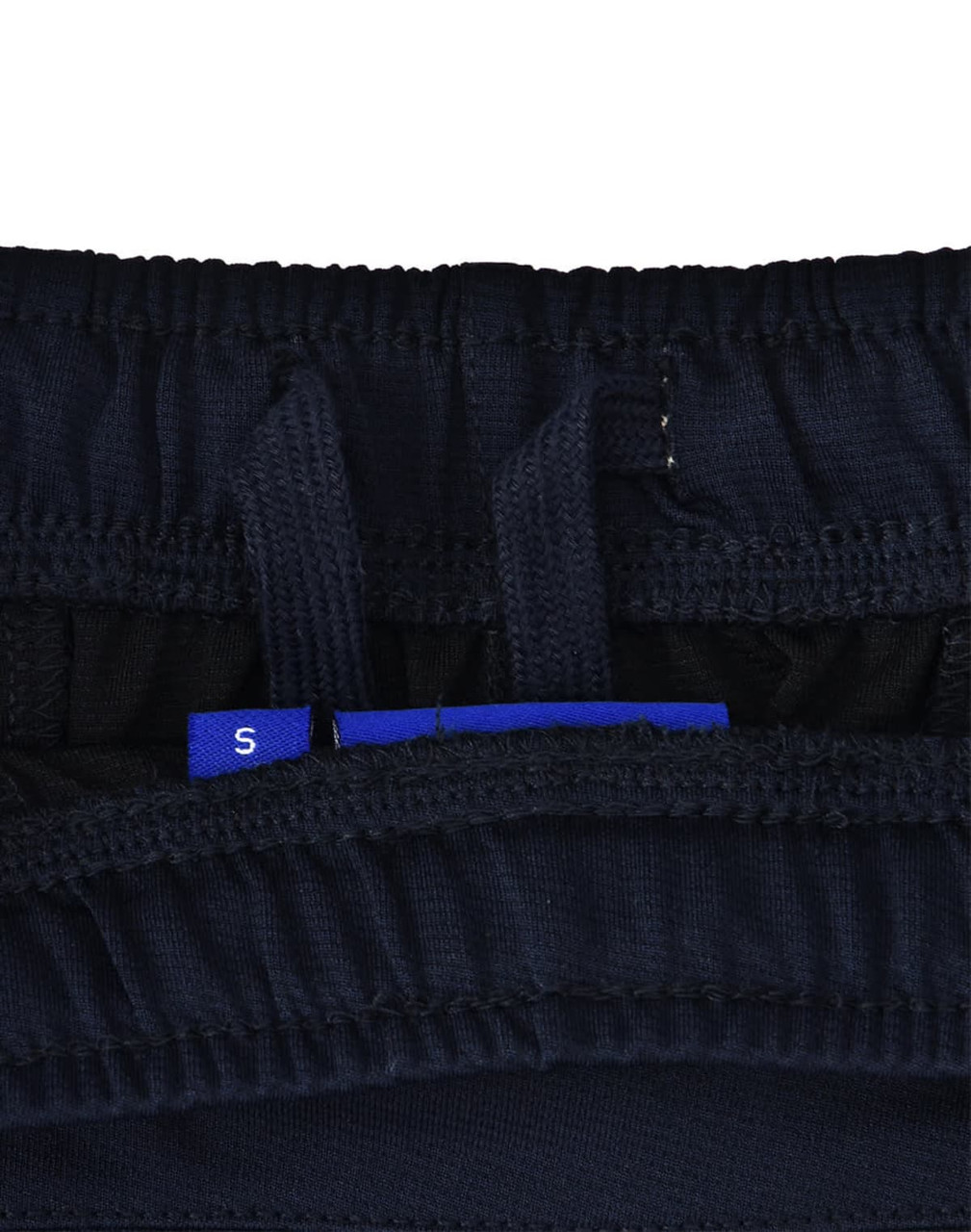 A close-up of navy blue sports shorts, featuring an interior waistband with adjustment tags and a logo.