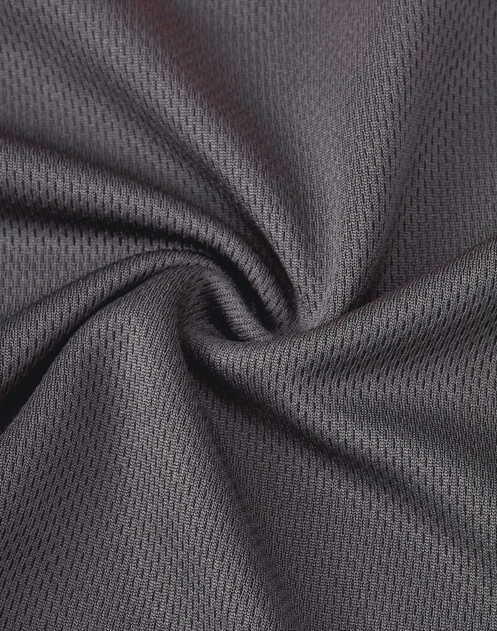 A close-up of grey segmented mesh fabric, showcasing its breathable texture and pattern.