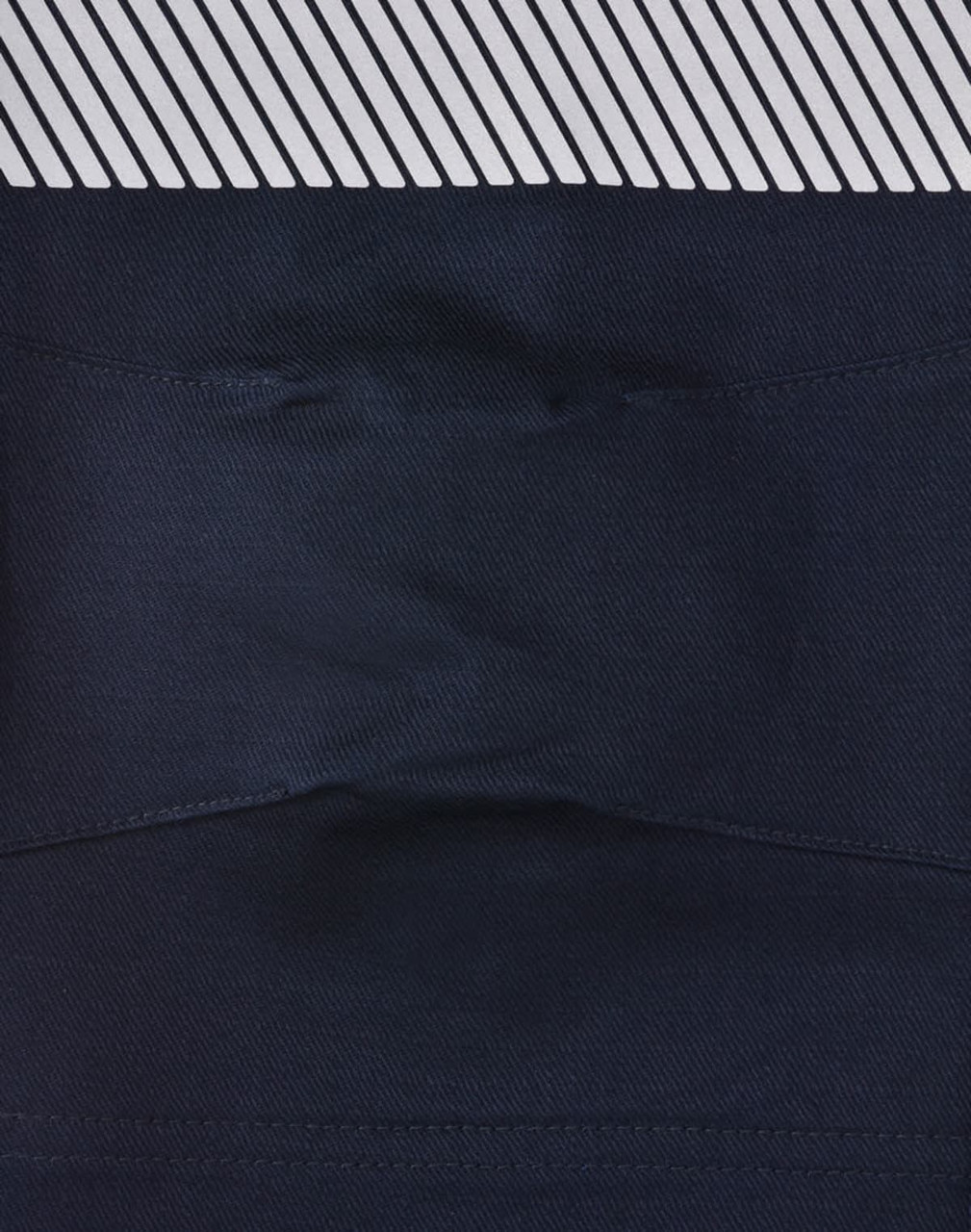 A pair of navy blue unisex cotton stretch ripstop segmented work pants with a patterned waistband and a logo.