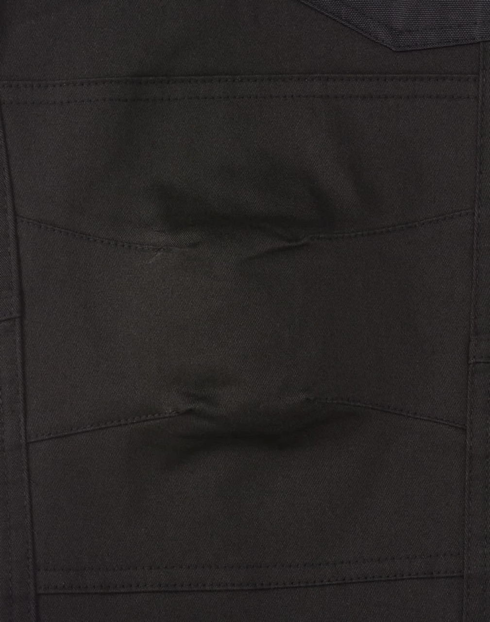 A close-up view of unisex black cotton stretch drill cuffed work pants, featuring pockets and a sturdy design.