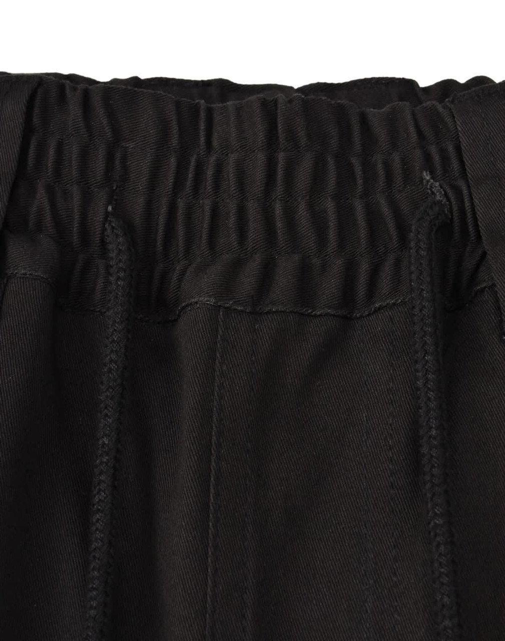 A close-up of the waistband of black unisex cotton stretch drill work shorts, featuring an elastic band and drawstring.
