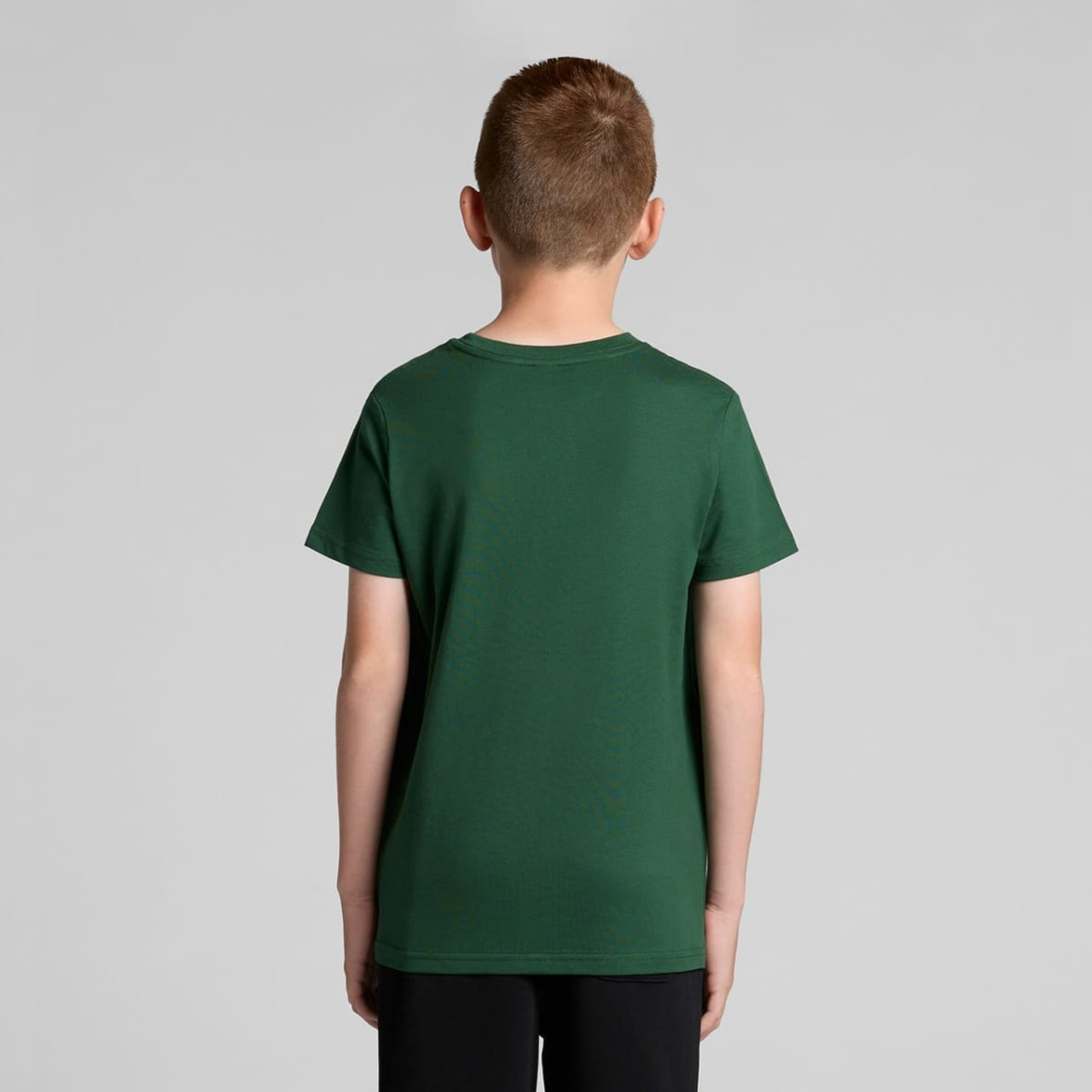 A green youth t-shirt with a classic cut, featuring a logo on the back. A green youth t-shirt with a classic cut, featuring a logo on the back.