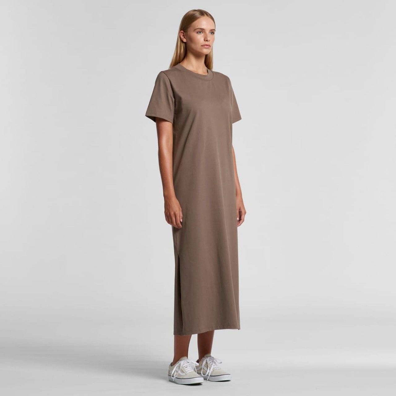 A brown, short-sleeved maxi dress with side slits and a relaxed fit, featuring a logo on the chest.