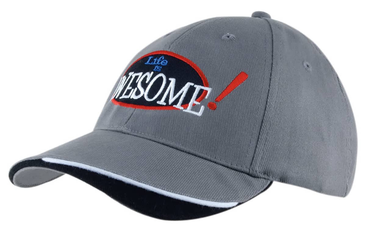 A grey cap with an indented peak, featuring a logo and contrasting colours.