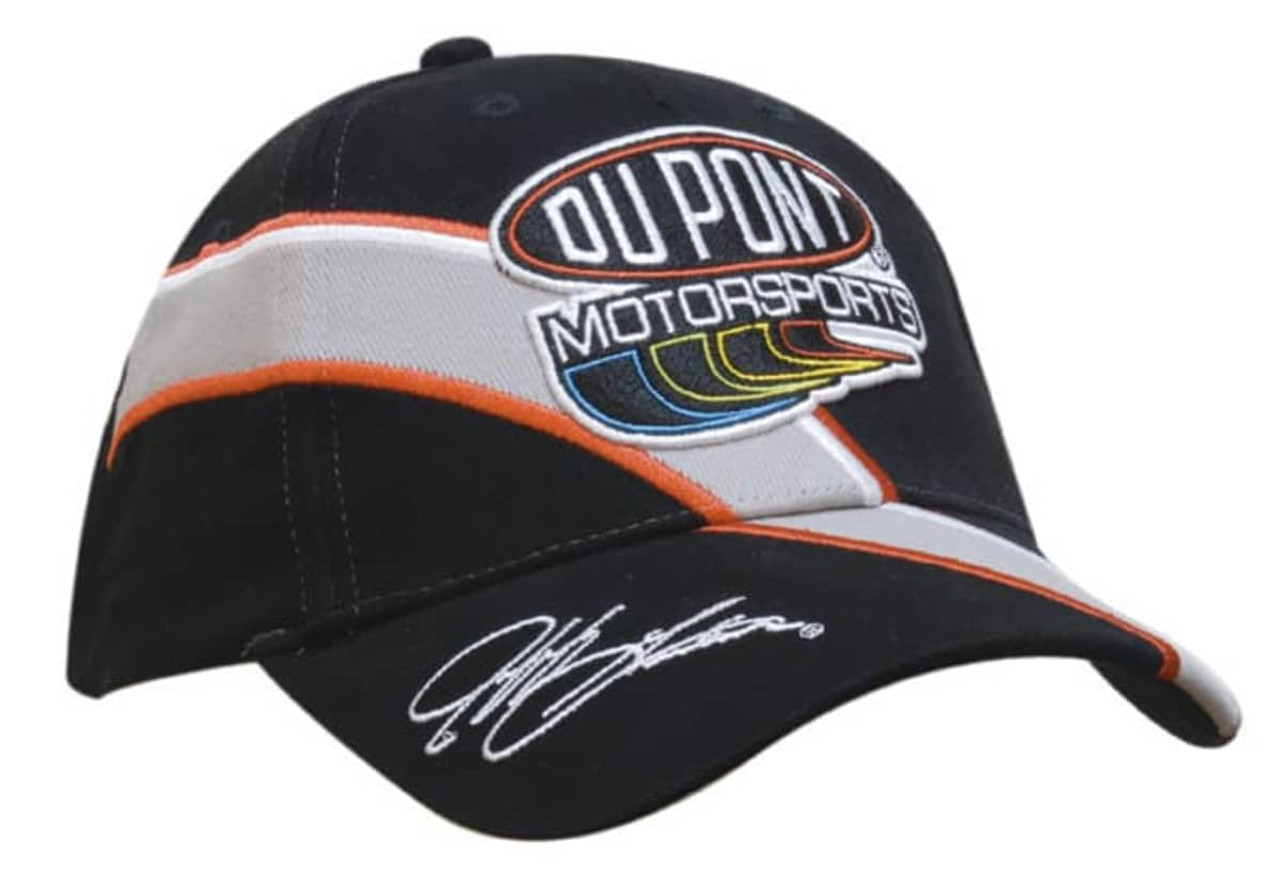 A black brushed cotton cap with embroidered trim and inserts, featuring a logo and signed detailing. A black brushed cotton cap with embroidered trim and inserts, featuring a logo and signed detailing.