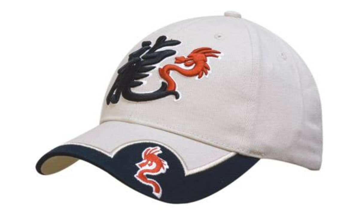 A beige cap with a peak insert, featuring embroidered dragon designs in black and red.